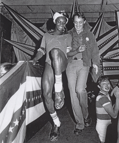 Harvey dancing on the stage during inaugural party.