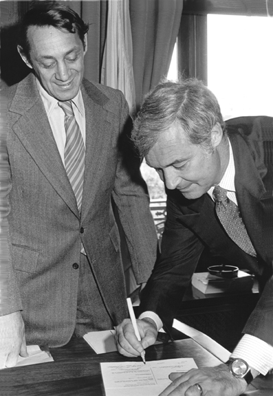 Supervisor Harvey Milk and Mayor George Moscone sign into law a San Francisco city ordinance banning discrimination in employment based on sexual preference. Moscone was happy to oblige Milk, the law's author by signing the ordinance with a lavender pen. 1978